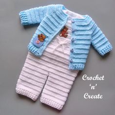 a knitted baby's outfit with teddy bear on the front and bottom, made to look like a cardigan