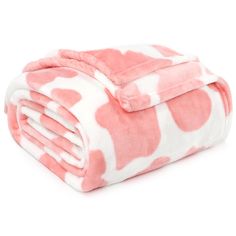 a pink and white blanket with hearts on it