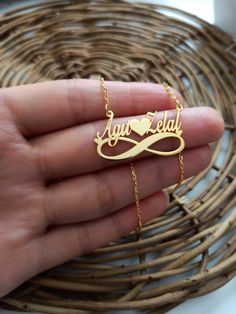 Color: on silver 14k gold plated Chain: .925 Silver Length: 40 cm 5 cm extension 45 cm Pendant size: 3cm/1.3 cm Material: 925 Sterling Silver Weight:3.45 grams Infinity necklace, which is one of the jewelry products designed for couples, will become a symbol of your love and will be a concrete representation of your lifelong love. This necklace, which you can buy as a gift for the woman you love, will suit your neck with its yellow color. There is an option to print name and date. Stylish design Necklace Name, Name Pendant, Minimal Necklace, Amulet Necklace, Infinity Necklace, Necklace Heart, Blue Evil Eye, Mehndi Designs For Hands, Evil Eye Necklace