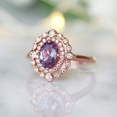 Beautiful Vintage Inspired Alexandrite Ring ►Can be paired with one or two half-eternity Milgrain bands of your choice (select option from a drop menu) ►Base Metal: Sterling Silver (S925) ►Plating: 14K Rose Gold Vermeil ►Accented With Simulated Diamonds Center Stone: Alexandrite Stone Cut: Oval Gem size: 7.0 x 5.0 mm Carat Weight: 0.76 (approx.) Gemstone creation: 100% Genuine Lab-Grown Alexandrite Stone Origin: Russia Hardness: 8.5 (Mohs scale) ►Handling time: 1-2 business days ►Free domestic s Dainty Promise Ring, Alexandrite Stone, Mohs Scale, Alexandrite Ring, Purple Band, Vermeil Jewelry, Solid Gold Jewelry, Fine Jewelry Collection, Anniversary Gift For Her