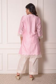 Baby pink chanderi kurta in floral thread work. Paired with lace hem pant.
Component: 2
Pattern: Embroidered
Type Of Work: Thread work
Neckline: V neck
Sleeve Type: Three quarter
Fabric: Chanderi
Color: Pink
Other Details: 
Organza scallop trims
Pintuck hem pant
Occasion: Mehendi and Haldi - Aza Fashions V Neck Kurta, Pink Thread, How To Hem Pants, Lace Hem, Fashion App, Thread Work, Pant Set, Set For Women, Aza Fashion