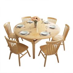 a round wooden table with six chairs around it and plates on the table, in front of a white background