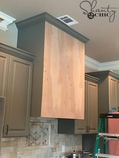 the kitchen cabinets are being painted gray