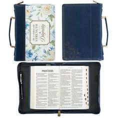 an open bible with blue flowers and gold trimmings on the front, in a case