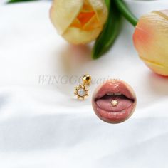 a close up of a person's mouth and nose with flowers in the background