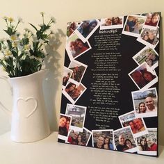 a white vase with flowers and pictures on it next to a black board that says happy birthday