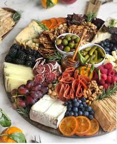 an image of a platter with cheeses, fruits and nuts on it for instagram