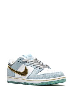 Shop Nike SB Dunk Low sneakers with Express Delivery - FARFETCH Nike Gold Sneakers For Streetwear, Gold Sneakers With Contrast Sole For Streetwear, Gold Low-top Sneakers With Contrast Sole, Nike Gold High-top Sneakers, Sporty Gold Low-top Custom Sneakers, Gold Low-top Sporty Custom Sneakers, Gold High-top Sneakers With Contrast Sole, Nike Custom Low-top Gold Sneakers, Nike Gold Sneakers With Boost Midsole