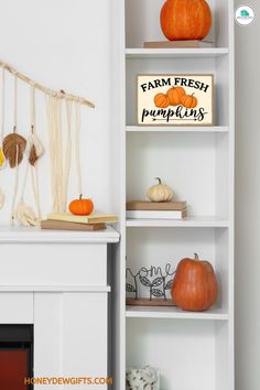 a white book shelf filled with pumpkins next to a sign that says farm fresh pumpkins