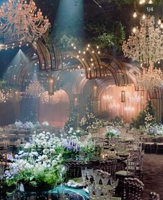 an elaborately decorated banquet hall with chandeliers and tables set for formal function