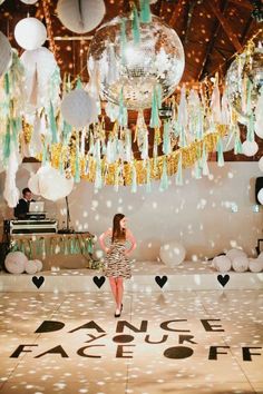 a woman standing in front of a dance floor