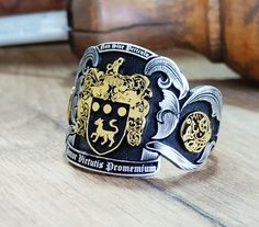 "Your custom solid sterling Silver ring will be made on your order, customize this Coat of Arms and your logo on this collection! A beautiful symbol that will fit your hands and style. perfect gift for anniversary, special dates and any date you can imagine can be Personalized. Different colors are silver, gold, rose gold. White gold and 24K gold options will never tarnish and last decades. Please contact me if you are interested in my jewelry. >ABOUT ME: I have 35 years of experience in making custom handmade silver and gold jewelry, including custom engraved Signet rings My childhood kind of allowed me to live among precious metals and gems pretty much I opened my workshop back in 1986 Never got bored of making Personalized gifts, birth flower rings, engagement rings with real diamonds F Black Sterling Silver Signet Ring With Engraving Option, Sterling Silver Engraved Ring For Commemoration, Customized Silver Engraved Ring For Anniversary, Custom Sterling Silver Engraved Ring, Custom Jewelry With Engraving Option, Custom Sterling Silver Signet Ring, Custom Silver Engraved Ring For Collectors, Silver Engraved Ring For Commemoration, Custom Silver Engraved Ring Collectible