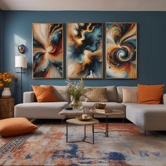 a living room filled with furniture and paintings on the wall above it's coffee table