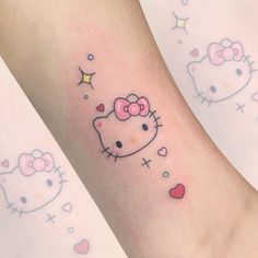 two hello kitty tattoos on both legs, one with a bow and the other with hearts