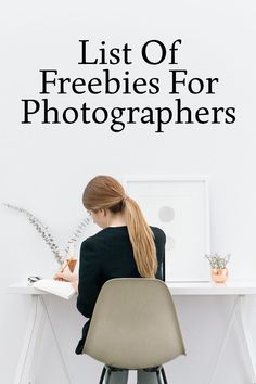 a woman sitting at a desk with a book in front of her and the words list of freebies for photographers