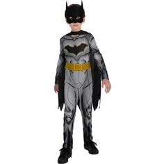 a little boy dressed up in a batman costume