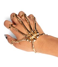 All that grabs is gold. Your hand is your most precious asset that you always forget to thank – but that’s about to change with the Gold Skeleton Finger Bracelet. Match your skeleton jumpsuit, bodysuit or dress with this powerful accessory and forget your phalanges no more. Ribcage Fashion, Gold Metal Jewelry For Costume Party, Gold Jewelry For Costume Party, Adjustable Gold Jewelry For Halloween, Gold Halloween Party Jewelry, Skeleton Jumpsuit, Golden Halloween, Skeleton Outfit, Skeleton Hand Bracelet