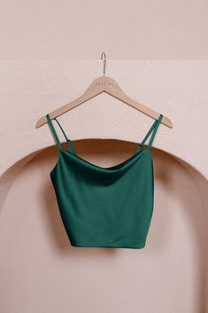 Our Flynn blouse is a slightly cropped satin top that matches perfectly with our Flora satin skirt. This blouse includes a gorgeous cowl neck and adjustable spaghetti straps. Summer Cropped Satin Halter Top, Cropped Satin Halter Top, Luxury Green Satin Top, Green Silk V-neck Top, Green Satin V-neck Top, Wedding Parties Colors, Bridesmaid Dress Colors, Satin Top, Satin Skirt