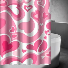 a pink and white shower curtain with hearts on it