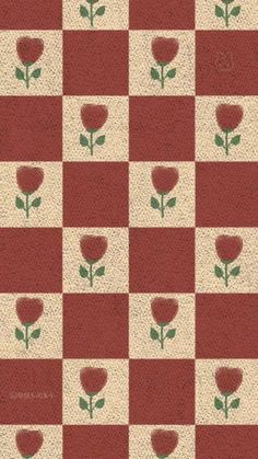 a red and white checkered pattern with flowers on it