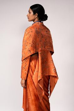 Orange jacket with french knots, sequins, resham knots, abstract bugle beads, glass beads and dabka embellishments. Comes with a digital printed skirt and a corset.
Components: 3
Pattern: Digital printed, Embellished
Type Of Work: French knots, Sequins, Resham knots, Abstract bugle beads, Glass beads, Dabka
Neckline: Sweetheart
Sleeve Type: Corset: Sleeveless, Jacket: Full
Fabric: Bemberg linen satin, Bemberg satin
Color: Orange
Other Details: 
Attached lining
Product Weight: 1.5 Kgs
Closure: Co Sweetheart Corset, Orange Jacket, Embellished Jacket, Women Skirt, Printed Skirt, French Knots, Satin Color, Skirt Sets, Bugle Beads