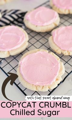 some cookies with pink icing are on a cooling rack and the words copycat crumbl chilled sugar