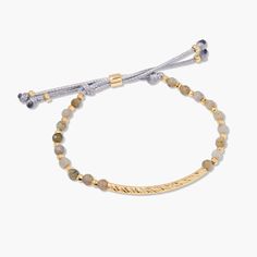 Inspire your style with the Savannah Gemstone Bracelet-Labradorite. This one-of-a-kind stunner features shining gold-plated accents and a luxurious Labradorite beads. Crafted with a toggle clasp, this exquisite bracelet will add a refined glow to your look. Available in 14k gold plated brass Size: 6" adjustable grey cord bracelet 1 1/2" hammered gold bar 4mm labradorite beads Protected with an anti-tarnish barrier SKU: BYB1211 Luxury Adjustable Labradorite Jewelry, Elegant Luxury Jewelry With Adjustable Cord, Luxury Adjustable Beaded Bracelet With Gemstones, Adjustable Beaded Labradorite Bracelets, Adjustable Gold Beaded Gemstone Bracelets, Bohemian Gold Labradorite Bracelet, Elegant Adjustable Labradorite Beaded Bracelets, Elegant Labradorite Beaded Bracelets, Hand-strung Labradorite Gold Jewelry