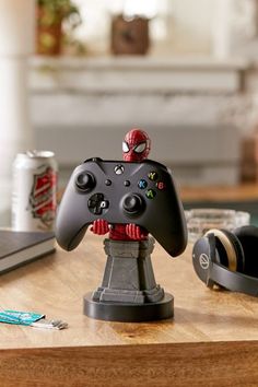 a black controller sitting on top of a wooden table