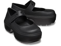 a pair of black clogs on top of each other