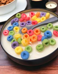 cereal in a bowl with spoon on table next to plates and bowls full of cereal