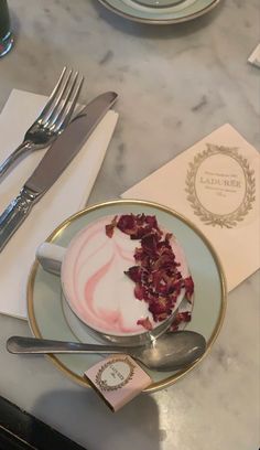 a plate with some food on it next to silverware