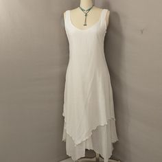 Beautiful 100% Cotton White Summer Dress. Never Worn, All Tags In Place. Two Layers, Wider Weave On Outer Layer, Finer Weave Inside. Scarf Hem Shoes Both. Size Marked Large, Shown On Both A 12 And An 8 Dress Form. Please Go By Measurements. Pit To Pit 20.5", Waist 38", Hips 50", Length 55". Low Scoop Neckline. Condition Excellent, As New, No Marks Or Damage. Slow Fashion Mexican Company, Many Pieces Organic Cotton. Resort Wear & Natural Fabric Focus. Made In Mexico. Fitted Sleeveless Lagenlook Dress, Bohemian Sleeveless Dress For Layering, Fitted Summer Dresses For Layering, Fitted Sleeveless Dresses For Layering, Flowy Sleeveless Dress For Layering, Casual White Dresses For Layering, V-neck Summer Dresses For Layering, V-neck Dresses For Summer Layering, Fitted Bohemian Dress For Layering