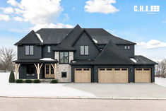 faux wood carriage house light oak garage doors on black modern style home with winter background Carriage Style Garage Doors, Faux Wood Garage Door, Commercial Garage Doors, Residential Garage Doors, Wood Garage Doors, Exterior House Color, Garage Door Design, Overhead Door, House Designs Exterior