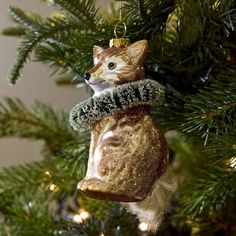 a cat ornament hanging from a christmas tree