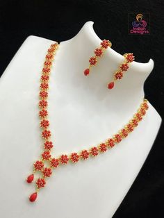 American Diamond Multicolor Gemstone Necklace Set, a luxurious addition to any formal or celebratory attire. Intricately crafted with the lustrous sparkle of American diamonds and a symphony of colored stones resembling ruby, emerald, and sapphire hues, this necklace exudes royalty. Accented with red coral and timeless pearls, the set includes a pair of matching earrings that gracefully complement the necklace. Whether for a wedding, gala, or special cultural event, this necklace set is sure to make a statement and cherish your moments. Coral Jewelry Set, Cz Jewelry, Kundan Necklaces, Coral Jewelry, Coral Blue, American Diamond, Red Coral, Elegant Earrings, Stone Necklace