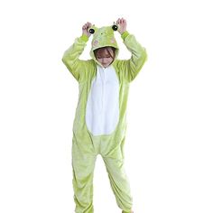 a person in a frog costume standing with his hands on their head and eyes closed