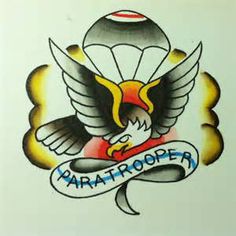 the logo for paratrooper is painted on a white wall with an eagle holding a banner