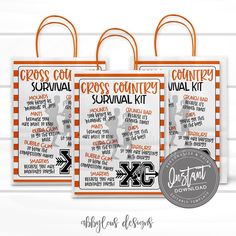 two orange and white bags with the words cross country survival kit