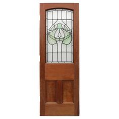 a wooden door with a stained glass window