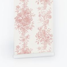 a pink and white floral wallpaper with roses on the side, against a white background