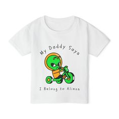 Is your little one out of this world? Celebrate their quirky charm with this delightfully playful short sleeve T-shirt that's sure to make everyone smile. Featuring the fun and quirky slogan, "My Mommy Says I Belong to Aliens," this tee is perfect for toddlers who are as unique as they are adorable. The Gildan 5100P Heavy Cotton™ tee for toddlers brings incredible style and ecologic sensibility to the table. Made with 100% cotton (Sport Grey is 90/10 cotton/polyester), each tee offers top-tier softness to the touch. Meanwhile, the classic width and rib collar add a nice touch of style and all-day comfort. Playful White T-shirt For Father's Day, Father's Day Character Print Cotton T-shirt, Father's Day T-shirt With Character Print And Short Sleeves, Cosmic Space, Toddler Rocker T Shirt, Space Tee, Playful Cotton T-shirt With Dinosaur Print, Cotton Pullover, Top Tier