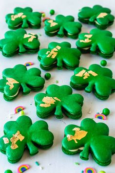 some green cookies with gold leaf designs on them