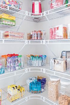 an open refrigerator filled with lots of food and drink items, including cereals in containers