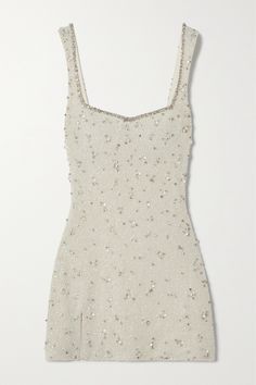 a white dress with sequins on it