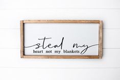 a wooden sign that says steal my heart not my blankets hanging on a white wall