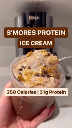 someone is holding up a cup of ice cream with chocolate chips in it and the text smores protein ice cream 350 calories