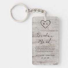 a wooden keychain with a heart and the words, no bridals me up