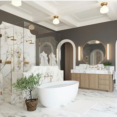 a bathroom with marble walls and flooring, white bathtub next to a plant