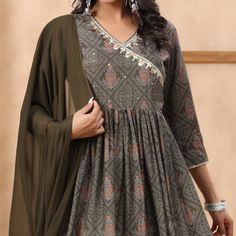 Grey colored suit is prettified with Jaipuri and sequins work as shown which makes it appear classy. This top is made of muslin fabric which is accompanied with santoon bottom and chiffon dupatta. Women can buy this suit to wear for their parties and functions. Note:- The actual product may differ slightly in color and design from the one illustrated in the images when compared with computer or mobile screen. Size Chart Size: Semi Stitched/Unstitched can be altered from maximum to minimum size b Silk Art, Chiffon Dupatta, Mobile Screen, Anarkali Suit, Muslin Fabric, Chiffon Saree, Screen Size, Georgette Sarees, Anarkali