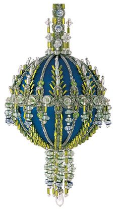 an elaborate blue and yellow object with crystal beads on it's sides, hanging from the ceiling